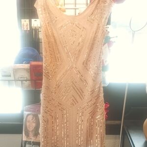 Beautiful dress with sequins nude color with beautiful golden sequins.